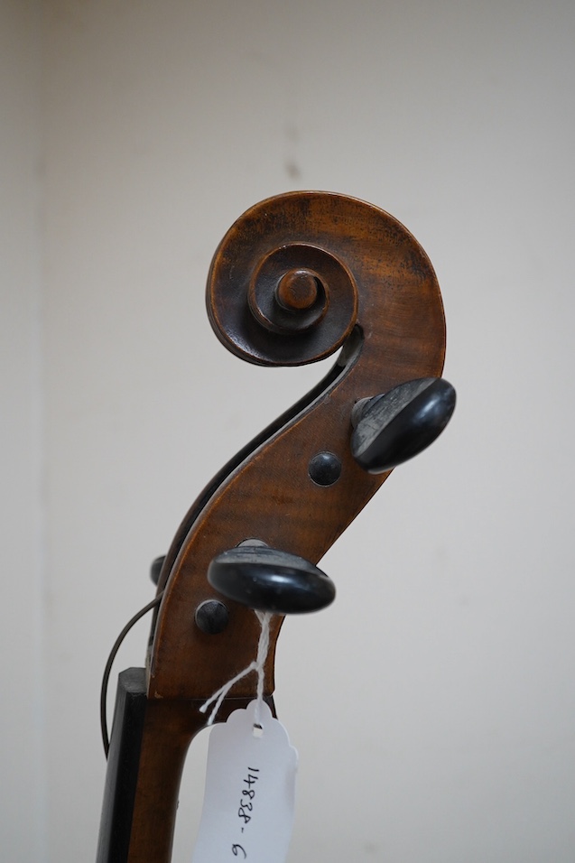 A late 19th century small cello, unsigned and without label inside body, stamped inventory number 769, length of back 62cm. Condition - poor to fair